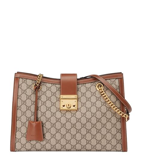 gucci gg bag with push lock closure nd interior pocketa|Gucci Medium Padlock GG Shoulder Bag .